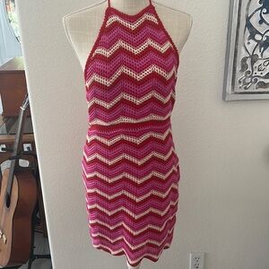 brand, new crochet, mini pink and red backless never worn. Runs like a medium.